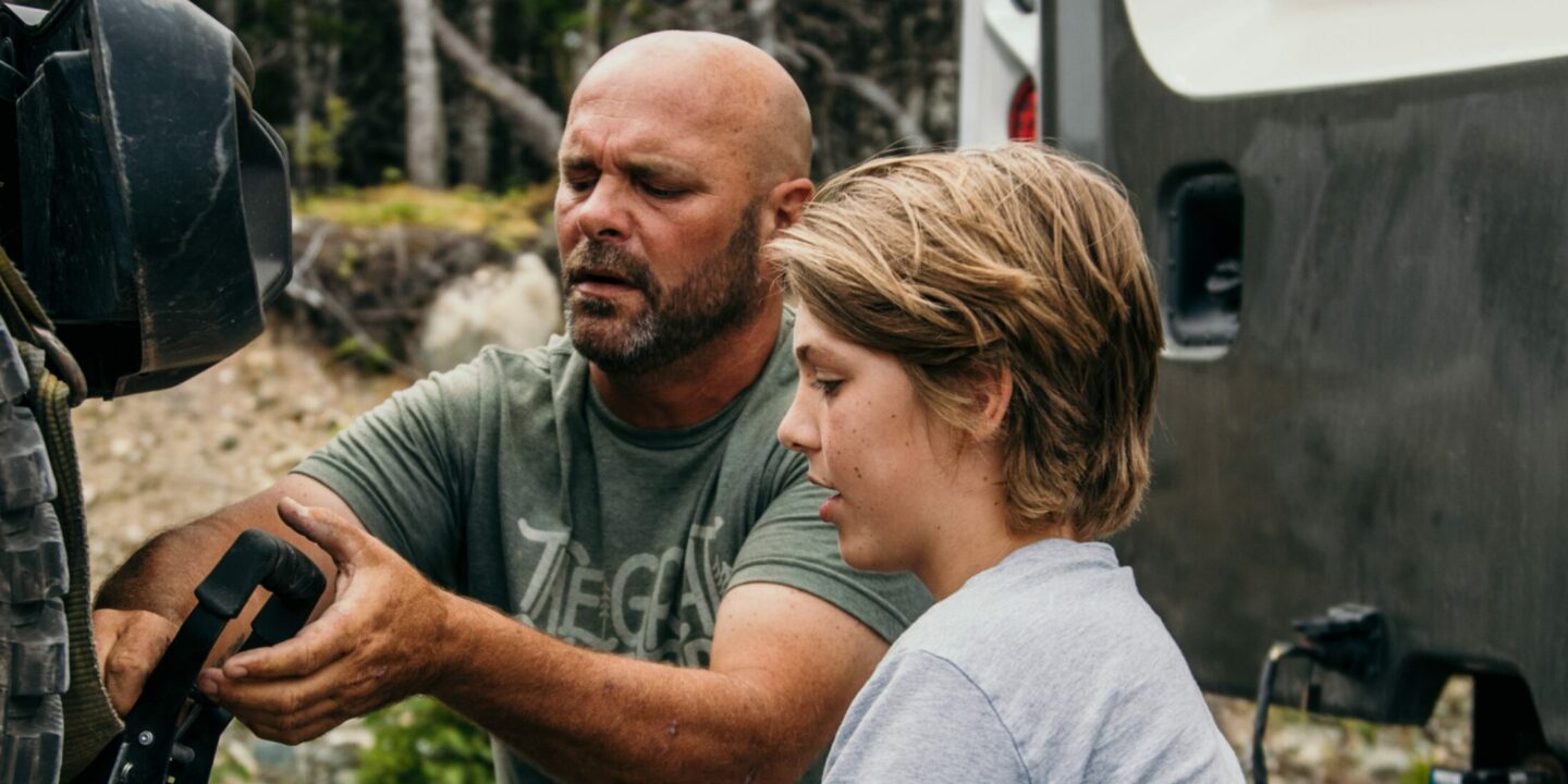 Bryan Baeumler and son hitching vehicle to RV