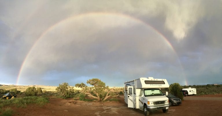 RV in front of a rainbow