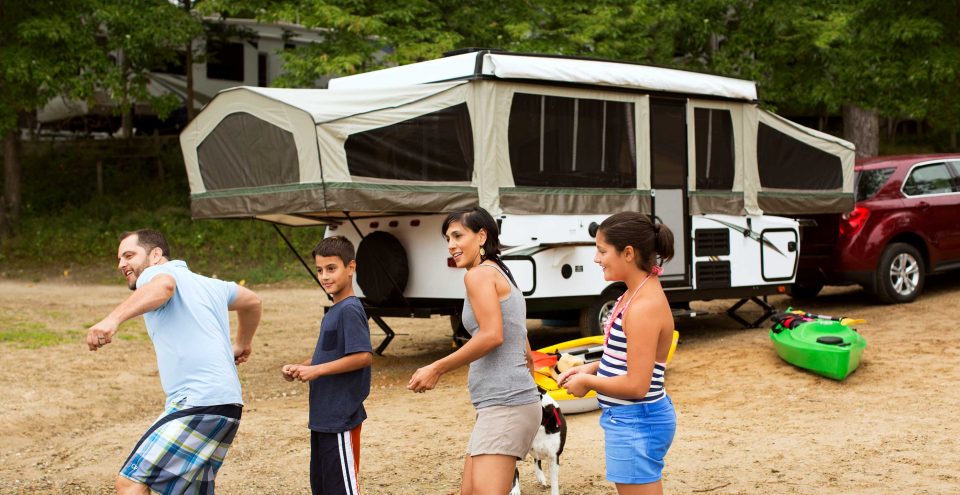 family with pop up camper