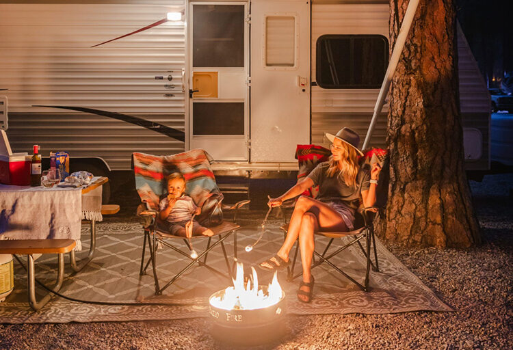 mom and child with camper