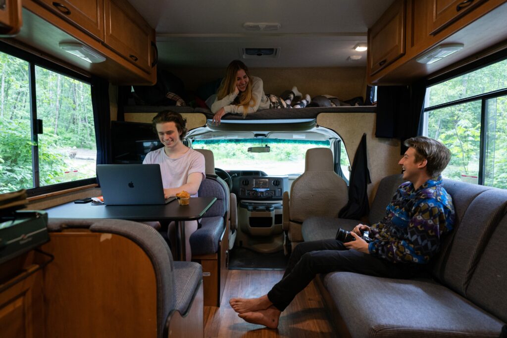 group of friends working from an RV