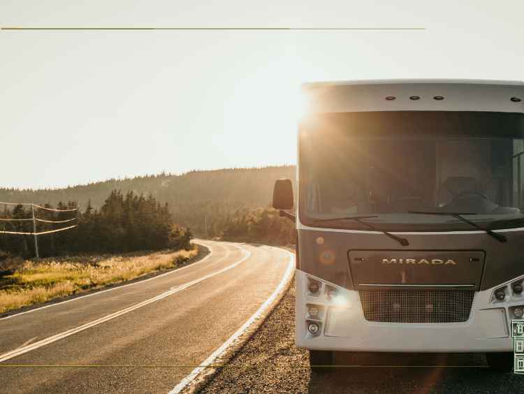 Bryan Baeumler's RV driving along the road with the sun in the background