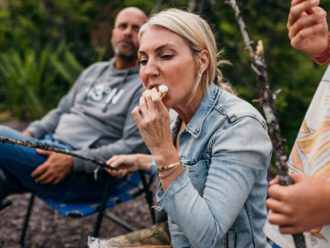 Sarah Baeumler eating a s'more