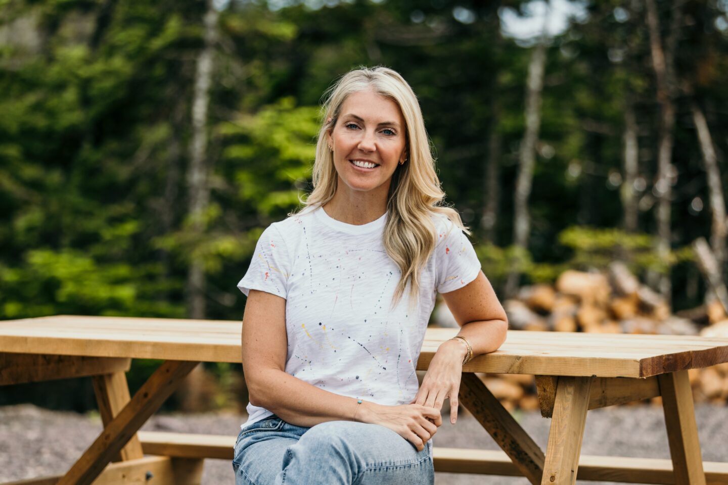 Sarah Baeumler posing for a photo at a campsite