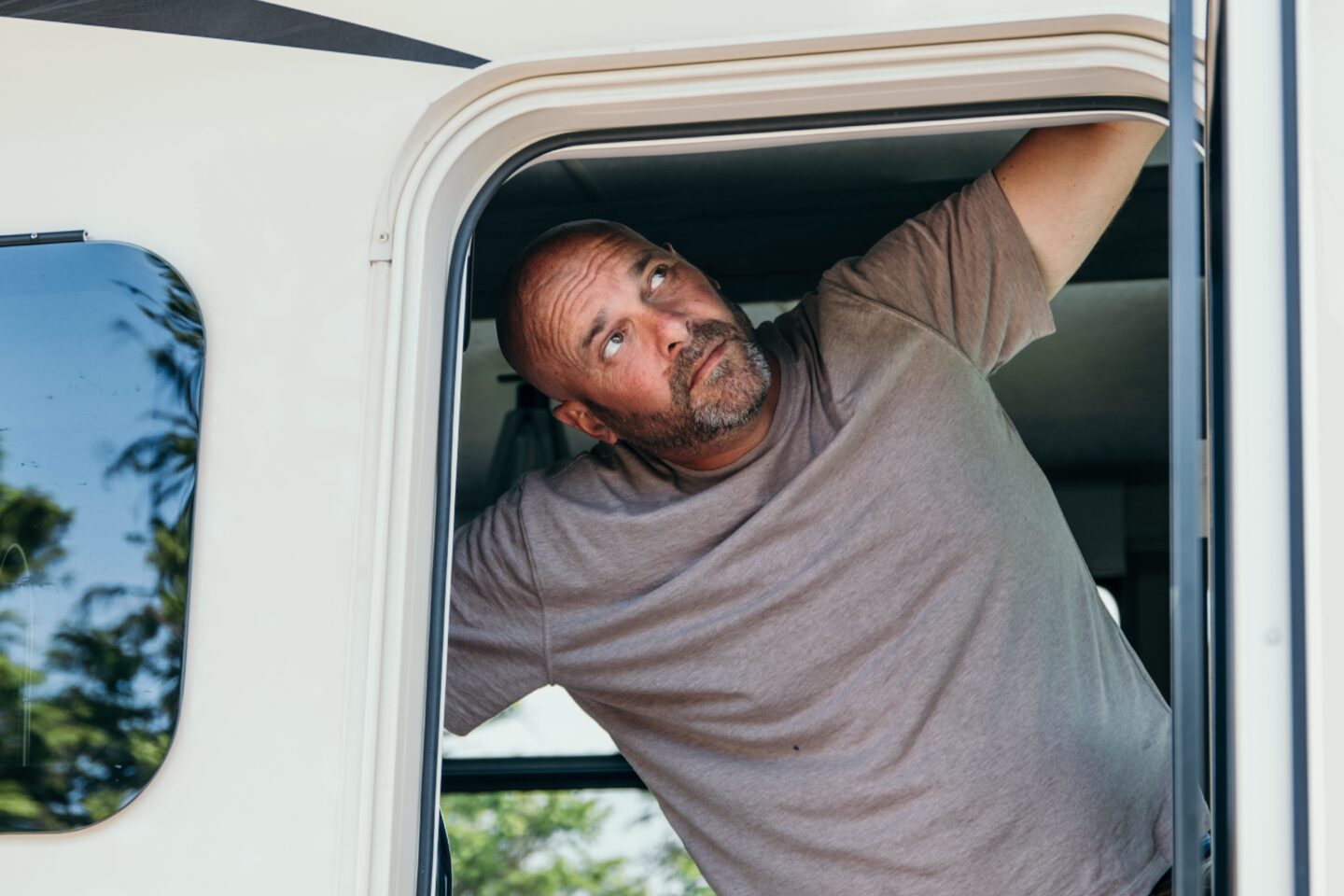 Bryan Baeumler looking out of the door to his RV