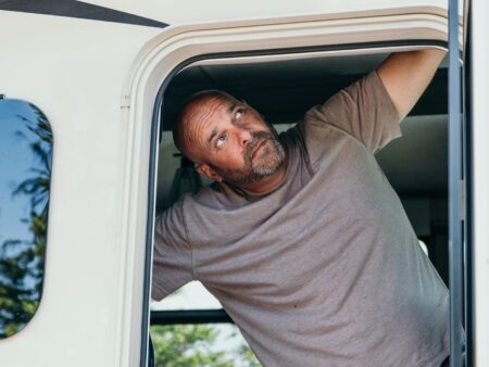 Bryan Baeumler looking out of the door to his RV