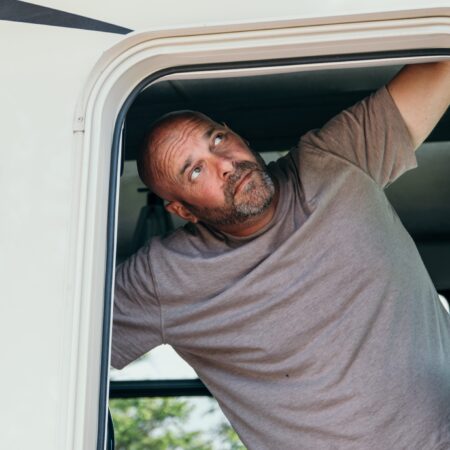Bryan Baeumler looking out of the door to his RV