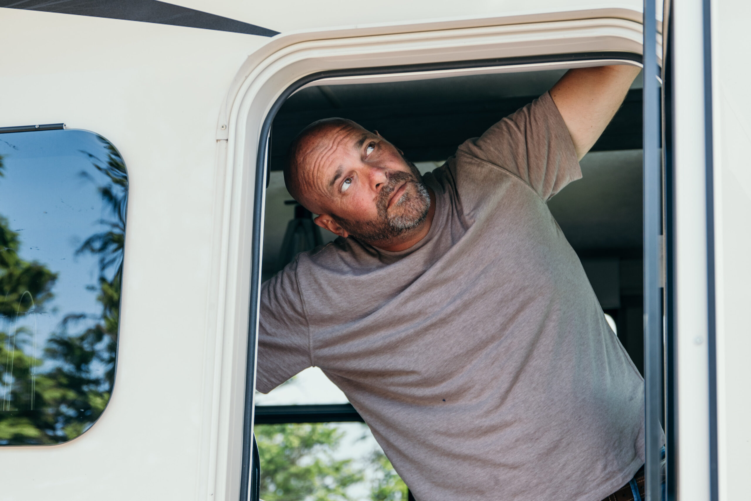 Bryan Baeumler looking out of the door to his RV