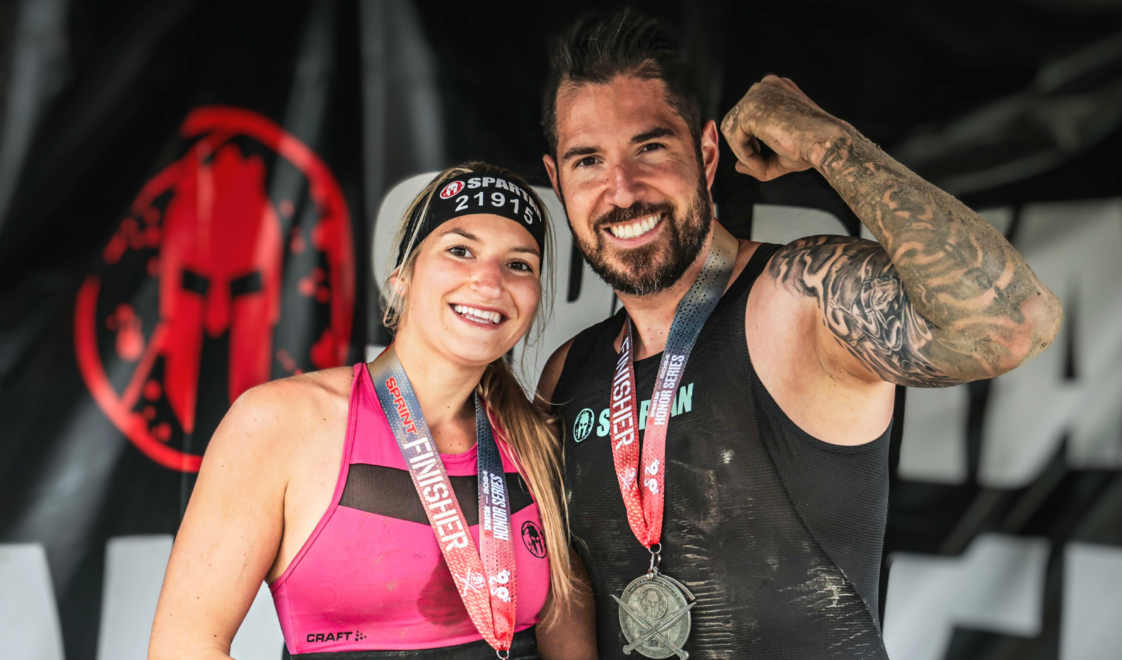 Spartan Race Canada ambassador Alexandre Contreras and his wife Julie on the Spartan Race podium
