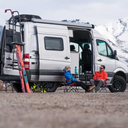 class b camper van parked as campers prepare to go skiing