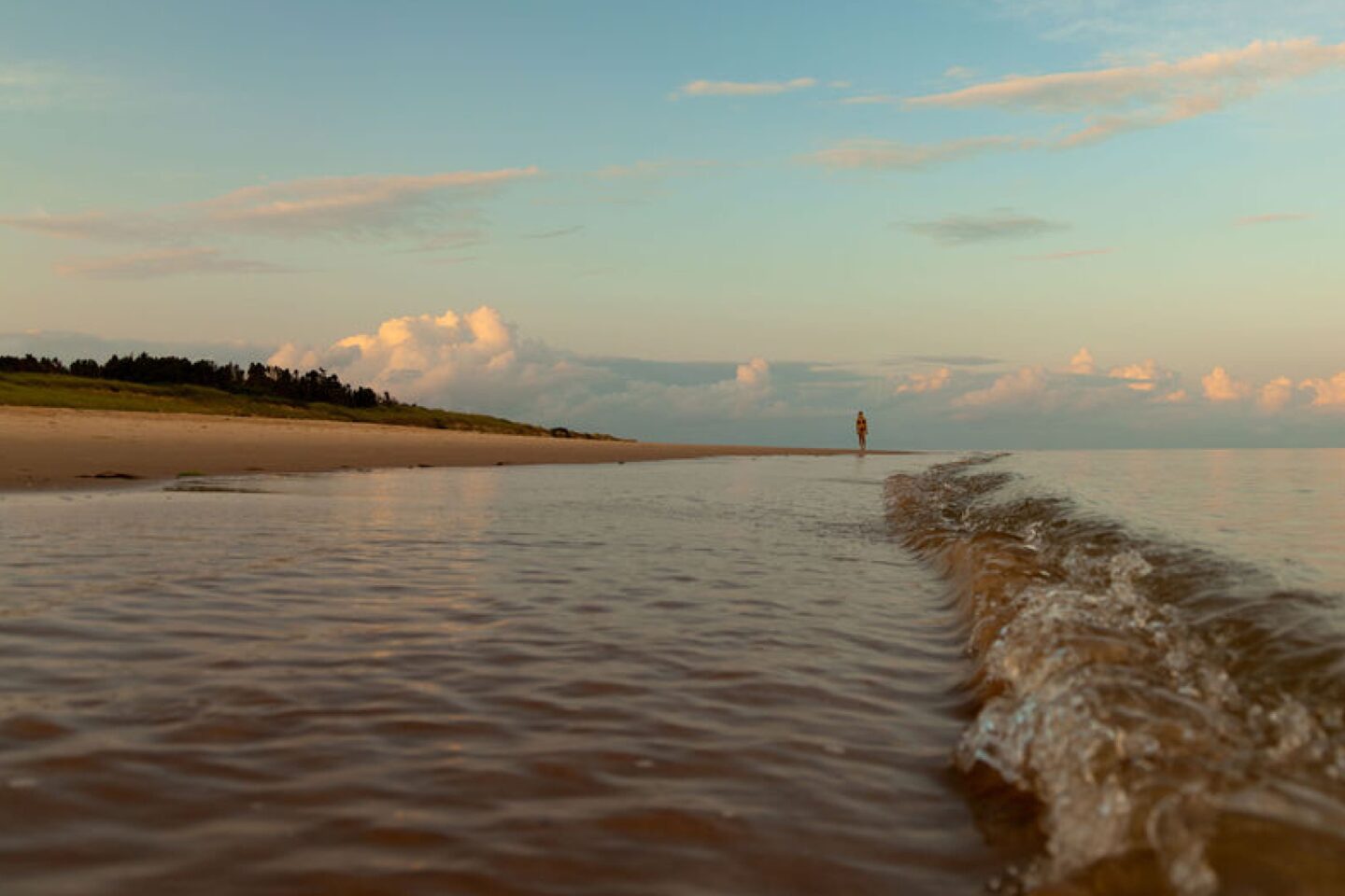 Woman walking along a beach