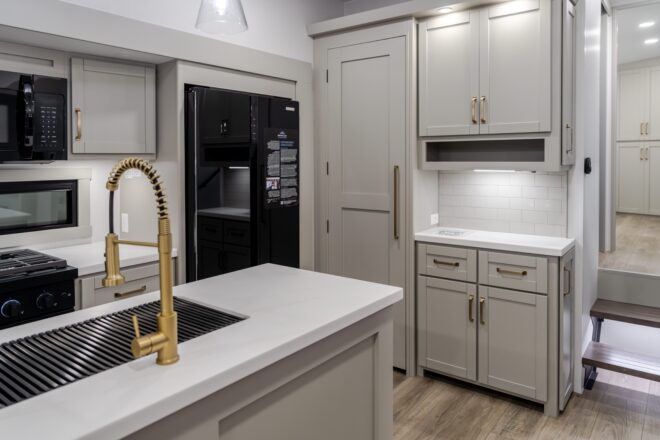 Upgraded faucets and handles in an RV kitchen