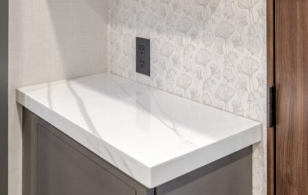 An RV kitchen with updated peel and stick wallpaper