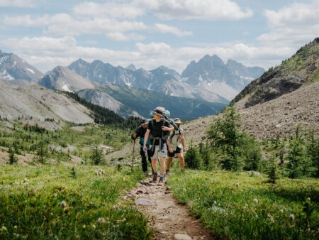 Three friends hiking to Mount Assiniboine in Kananaskis Provincial Park on RV trip