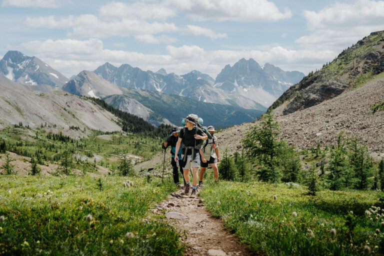 Three friends hiking to Mount Assiniboine in Kananaskis Provincial Park on RV trip
