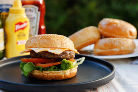 Cheeseburger on a plate at the campsite