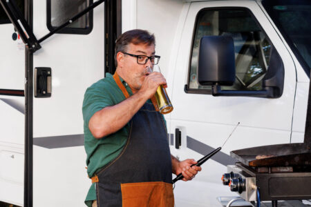 Pat Roach from Trailer Park Boys (Randy) cooking a burger at the RV