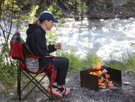Woman drinking coffee at Canyon RV Resort