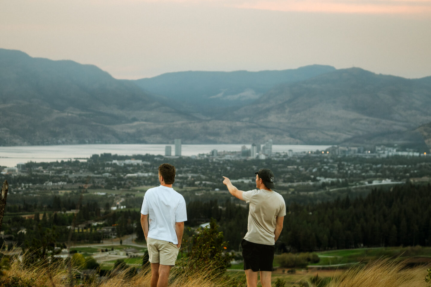 Two friends overlooking Kelowna BC on weekend RV Road Trip