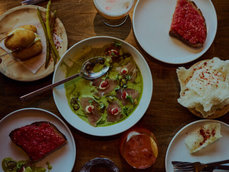 Table spread of Spanish tapas and local wine at Bocado restaurant on Picton Main Street